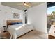 Bright bedroom with a king-size bed and large window at 100 W Portland St # 401, Phoenix, AZ 85003