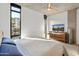 Spacious bedroom with large window and wood dresser at 100 W Portland St # 401, Phoenix, AZ 85003