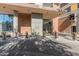 Modern building entrance with water feature and landscaping at 100 W Portland St # 401, Phoenix, AZ 85003
