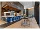Community lounge with a bar, comfortable seating, and a TV at 100 W Portland St # 401, Phoenix, AZ 85003