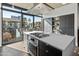 Modern kitchen with island, stainless steel appliances, and city views at 100 W Portland St # 401, Phoenix, AZ 85003