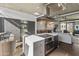 Open kitchen with island, gas cooktop and modern cabinetry at 100 W Portland St # 401, Phoenix, AZ 85003