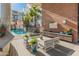 Community pool with lounge area and outdoor kitchen at 100 W Portland St # 401, Phoenix, AZ 85003