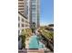 Refreshing community pool with lounge chairs and palm trees at 100 W Portland St # 401, Phoenix, AZ 85003