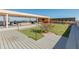 Modern rooftop deck with grilling station and grassy area at 100 W Portland St # 401, Phoenix, AZ 85003