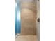 Large shower with beige tile and glass partition at 100 W Portland St # 401, Phoenix, AZ 85003