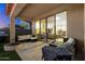 Back patio with sliding glass doors, comfortable seating, and outdoor grill at 11517 E Unity Ave, Mesa, AZ 85212