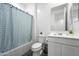 Clean bathroom featuring a shower/tub combo, white vanity, and modern fixtures at 11517 E Unity Ave, Mesa, AZ 85212