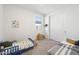 Cozy ' bedroom with twin beds, neutral carpet, and a bright, cheerful atmosphere at 11517 E Unity Ave, Mesa, AZ 85212