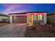 Attractive single-Gathering home with a two-car garage, stylish brick driveway, and colorful pink lighting accents at 11517 E Unity Ave, Mesa, AZ 85212