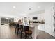 Bright kitchen features a granite island with barstool seating and stainless steel appliances at 11517 E Unity Ave, Mesa, AZ 85212
