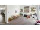Spacious playroom with carpet flooring, furniture, shelving, and a large window at 11517 E Unity Ave, Mesa, AZ 85212