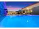 Beautiful private pool with waterfall feature, lounge area, and privacy fence, perfect for entertaining guests at 11517 E Unity Ave, Mesa, AZ 85212