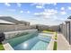 A beautifully designed pool with elegant stone accents provides a refreshing escape in this backyard at 11517 E Unity Ave, Mesa, AZ 85212