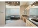 Spa-like bathroom with a soaking tub, glass block windows, and slate flooring at 12129 N 114Th Way, Scottsdale, AZ 85259