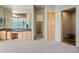 Main bathroom with dual sinks, a large shower, and a separate toilet at 12129 N 114Th Way, Scottsdale, AZ 85259