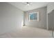 Bedroom with sliding door to patio and ceiling fan at 12129 N 114Th Way, Scottsdale, AZ 85259