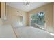Bedroom with mirrored closet doors and backyard access at 12129 N 114Th Way, Scottsdale, AZ 85259
