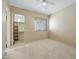 Bedroom with walk-in closet and ceiling fan at 12129 N 114Th Way, Scottsdale, AZ 85259