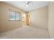 Bright bedroom with carpeted floors and ceiling fan at 12129 N 114Th Way, Scottsdale, AZ 85259