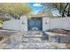 Elegant entryway with a custom metal gate and stone steps at 12129 N 114Th Way, Scottsdale, AZ 85259
