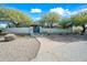 Stunning home exterior featuring a unique gate and landscaping at 12129 N 114Th Way, Scottsdale, AZ 85259