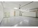 Spacious garage with ample storage space and epoxy floor at 12129 N 114Th Way, Scottsdale, AZ 85259