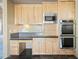 Built-in microwave and double ovens in this well-equipped kitchen at 12129 N 114Th Way, Scottsdale, AZ 85259