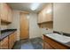 Laundry room with granite countertops and wood cabinets at 12129 N 114Th Way, Scottsdale, AZ 85259