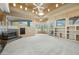 Open living room with fireplace, built-ins, and views at 12129 N 114Th Way, Scottsdale, AZ 85259