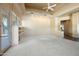 Spacious living area with built-in shelving and access to patio at 12129 N 114Th Way, Scottsdale, AZ 85259