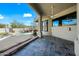 Covered patio overlooking the pool and waterfall feature at 12129 N 114Th Way, Scottsdale, AZ 85259