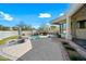 Relaxing patio with built-in fire pit and pool views at 12129 N 114Th Way, Scottsdale, AZ 85259
