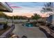 Inviting pool and spa, waterfall feature, sunset view at 12129 N 114Th Way, Scottsdale, AZ 85259