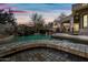 Expansive pool with tiled seating and waterfall at 12129 N 114Th Way, Scottsdale, AZ 85259
