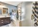 Clean bathroom with soaking tub and walk-in shower at 12858 W Wilshire Dr, Avondale, AZ 85392