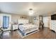 Spacious Primary bedroom with wood floors and en-suite bathroom access at 12858 W Wilshire Dr, Avondale, AZ 85392