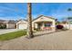 Charming single-story home with a covered porch and desert landscaping at 12858 W Wilshire Dr, Avondale, AZ 85392