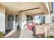 Welcoming front porch with red chairs and decorative accents at 12858 W Wilshire Dr, Avondale, AZ 85392