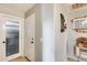 Home hallway with frosted glass door and storage at 12858 W Wilshire Dr, Avondale, AZ 85392