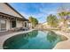 Inviting kidney-shaped pool with a covered patio area at 12858 W Wilshire Dr, Avondale, AZ 85392