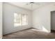 Bedroom with ceiling fan, large window, and neutral paint color at 1351 N Pleasant Dr # 1102, Chandler, AZ 85225