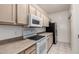 Kitchen with black appliances, updated countertops, and ample cabinet space at 1351 N Pleasant Dr # 1102, Chandler, AZ 85225