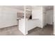 View of open concept kitchen with breakfast bar and white paint at 1351 N Pleasant Dr # 1102, Chandler, AZ 85225