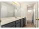 Ensuite bathroom features a long vanity and a separate space for the shower and toilet at 19520 N 65Th Ave, Glendale, AZ 85308