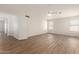 Spacious bedroom features wood-look floors, ceiling fan, and bright natural light at 19520 N 65Th Ave, Glendale, AZ 85308