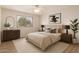 Serene bedroom with soft lighting, minimalist decor, and a large window with natural light at 19520 N 65Th Ave, Glendale, AZ 85308