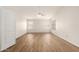Bright bedroom features wood-look floors, large windows, and a modern ceiling fan at 19520 N 65Th Ave, Glendale, AZ 85308