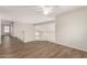 View of a bonus room that features wood-look floors, white railings, and bright lighting at 19520 N 65Th Ave, Glendale, AZ 85308