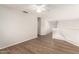 Bonus room with wood floors, ceiling fan, and an open view of the lower level at 19520 N 65Th Ave, Glendale, AZ 85308